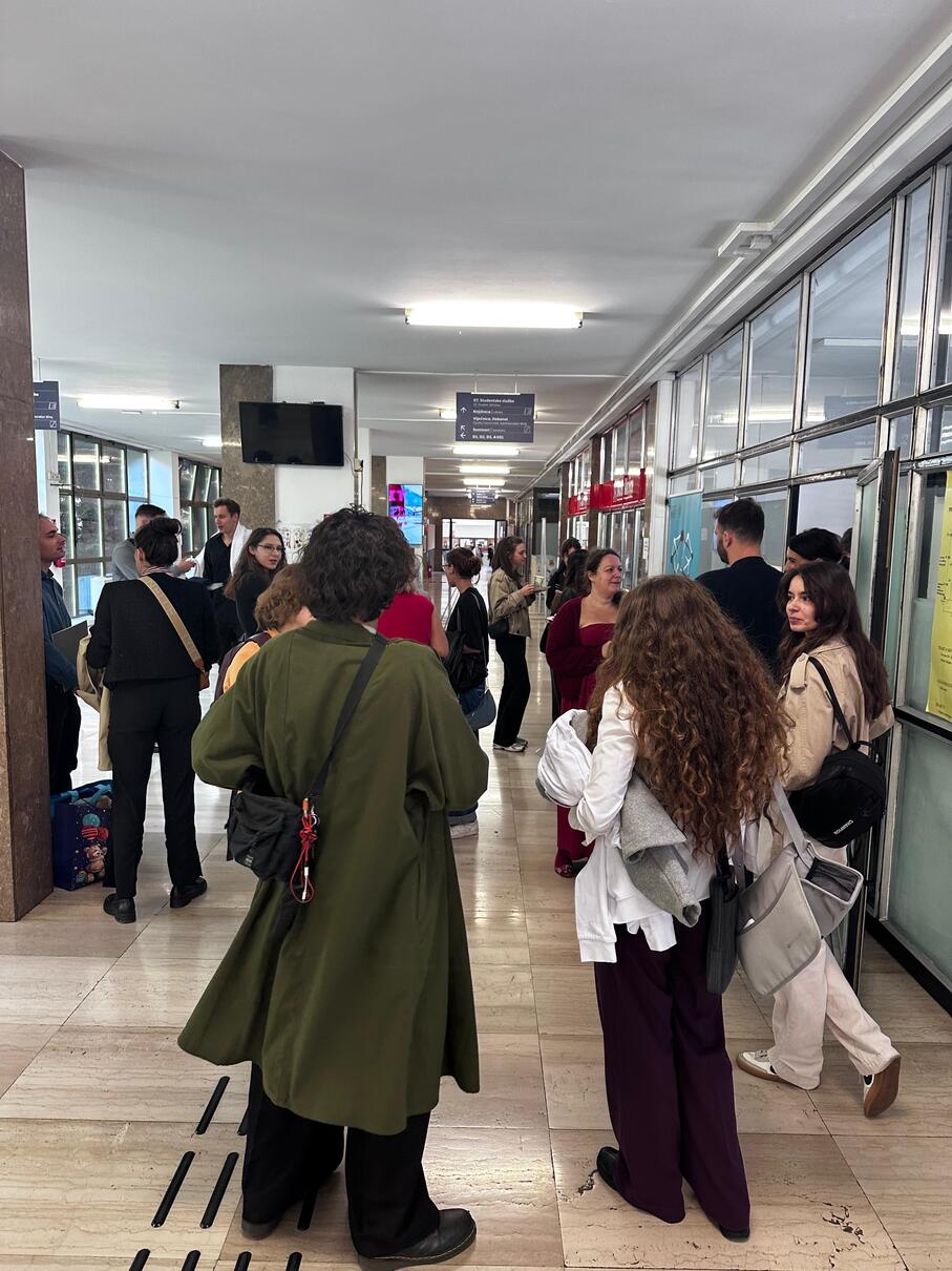 Graduates, families and guests gathered in the faculty corridor after the ceremony