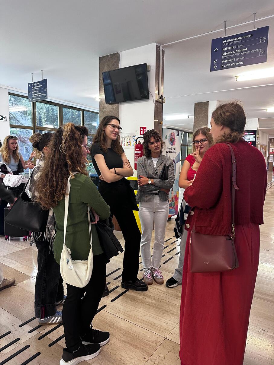 Students and guests talking together in the faculty foyer after the promotion